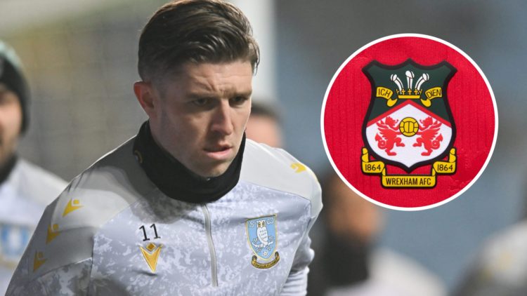 Josh Windass warms up during the Emirates FA Cup Third Round match between Coventry City and Sheffield Wednesday. Wrexham AFC badge on a home shirt.