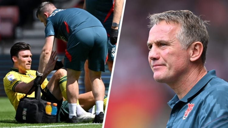 Kieffer Moore of Wrexham receives medical treatment (left), Phil Parkinson, Manager of Wrexham looks on (right)