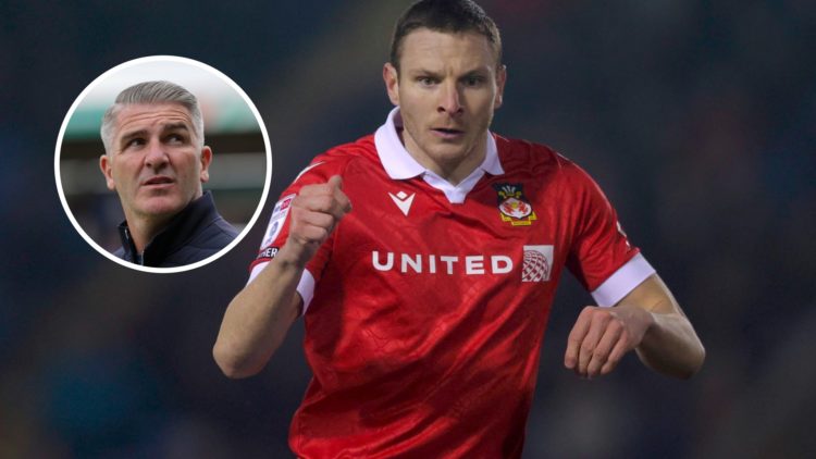Image of Paul Mullin in action for Wrexham against Shrewsbury Town. Wigan Athletic's manager Ryan Lowe looks on.