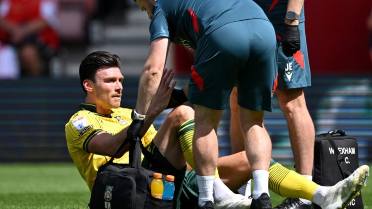 Kieffer Moore of Wrexham receives medical treatment
