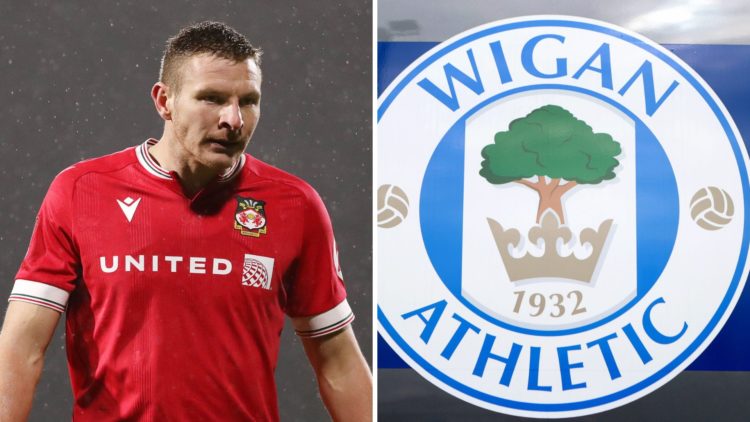 Paul Mullin during Wrexham v Yeovil Town - Emirates FA Cup Second Round. The club crest of Wigan Athletic is seen outside DW Stadium prior to the S...