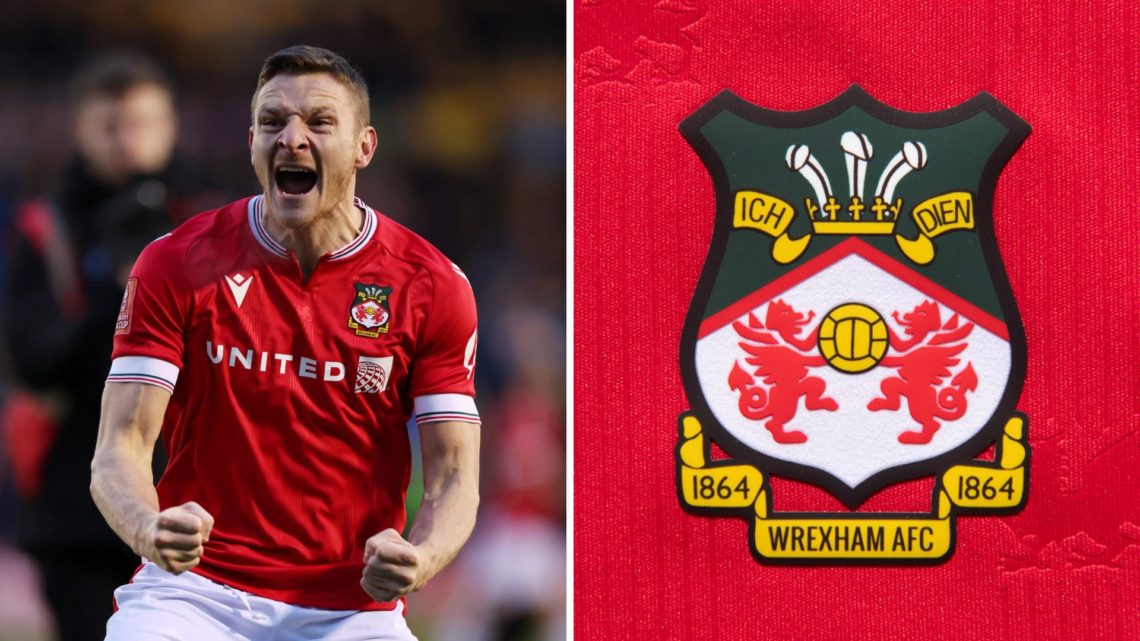 Paul Mullin celebrates after Wrexham's win over Shrewsbury Town in the FA Cup. The official club badge of Wrexham AFC on a home shirt.