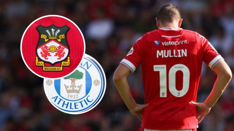 Paul Mullin during Wrexham v Doncaster Rovers - Sky Bet League Two. The official club badge of Wrexham AFC on a home shirt. The club crest of Wigan...
