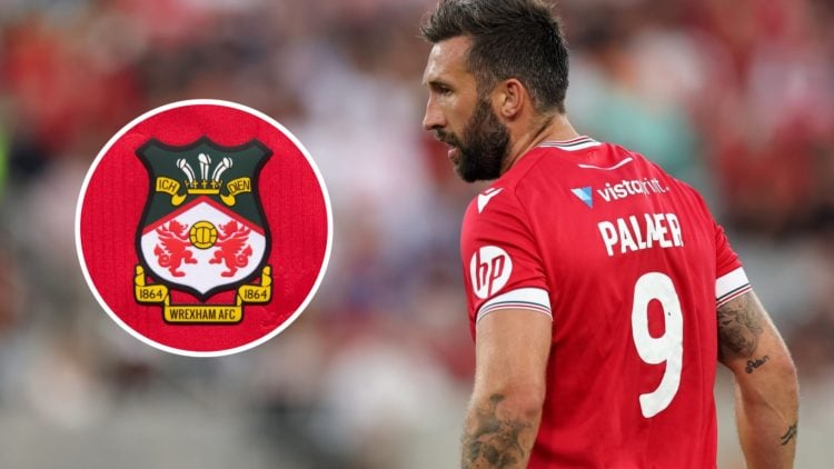 Ollie Palmer during Manchester United v Wrexham - Pre-Season Friendly. The official club badge of Wrexham AFC on a home shirt.