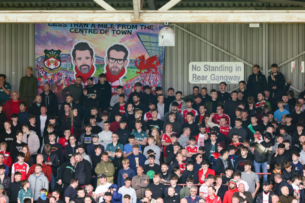 Fans of Wrexham watch on vs Stockport County