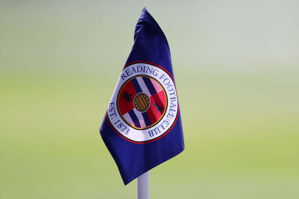 A corner flag with the logo of the Reading Football Club