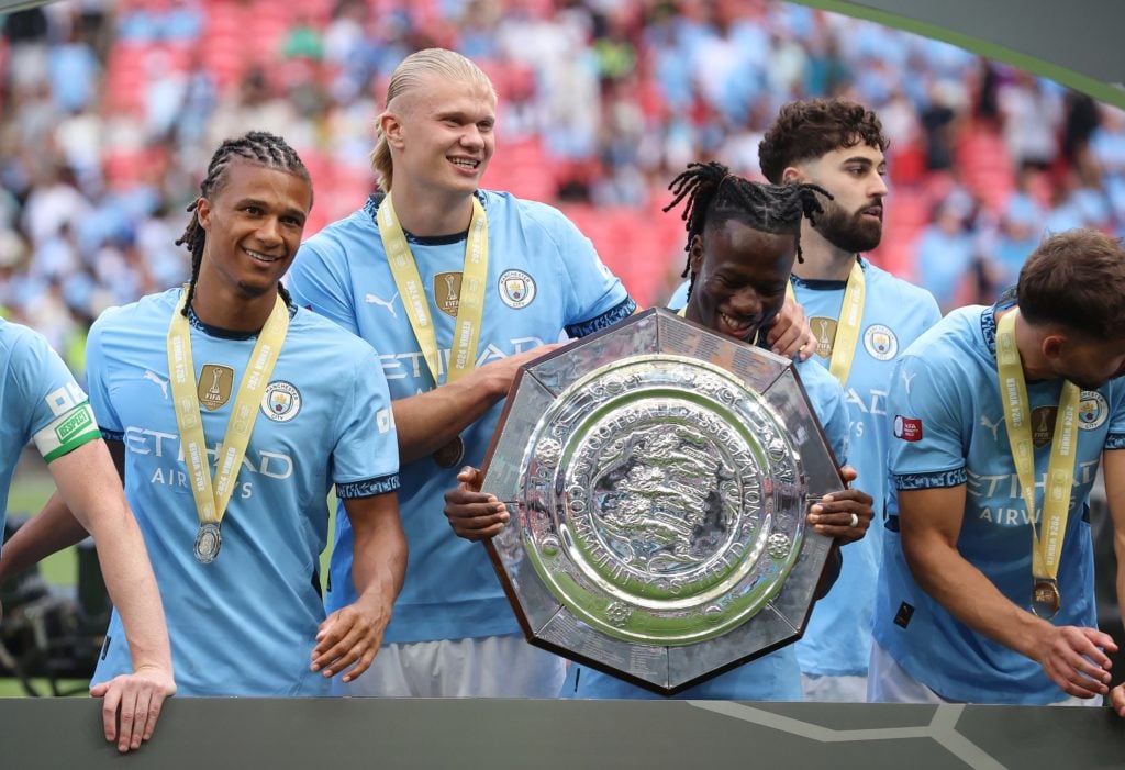 Erling Haaland and Issa Kabore of Manchester City holds aloft the FA Community Shield Trophy