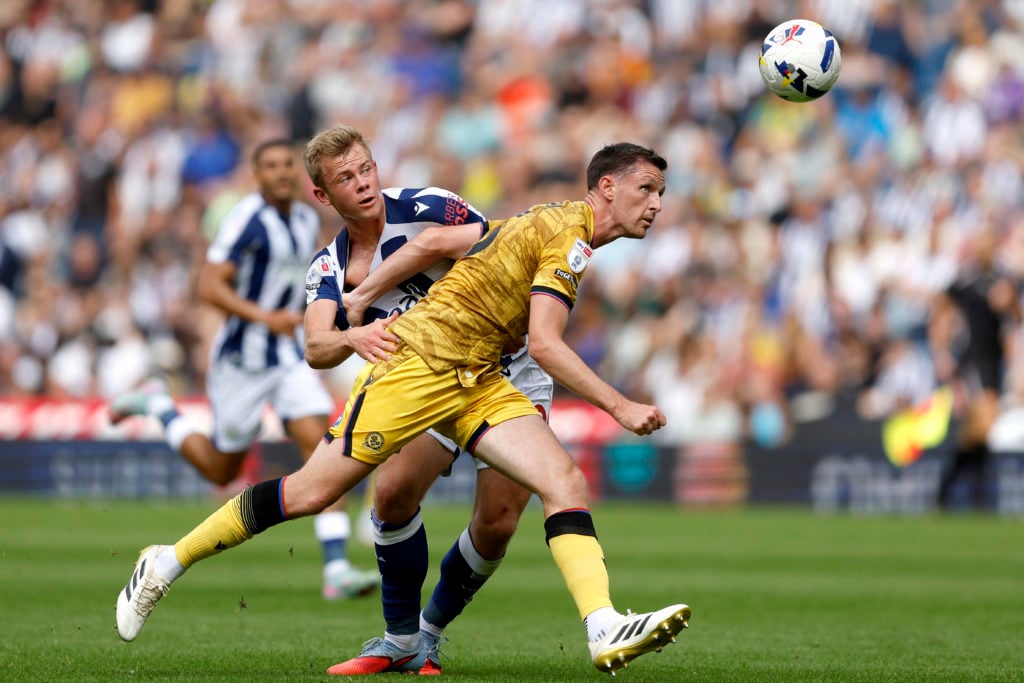 Dom Hyam of Blackburn Rovers pulls the shirt of Aune Heggebo of West Bromwich Albion