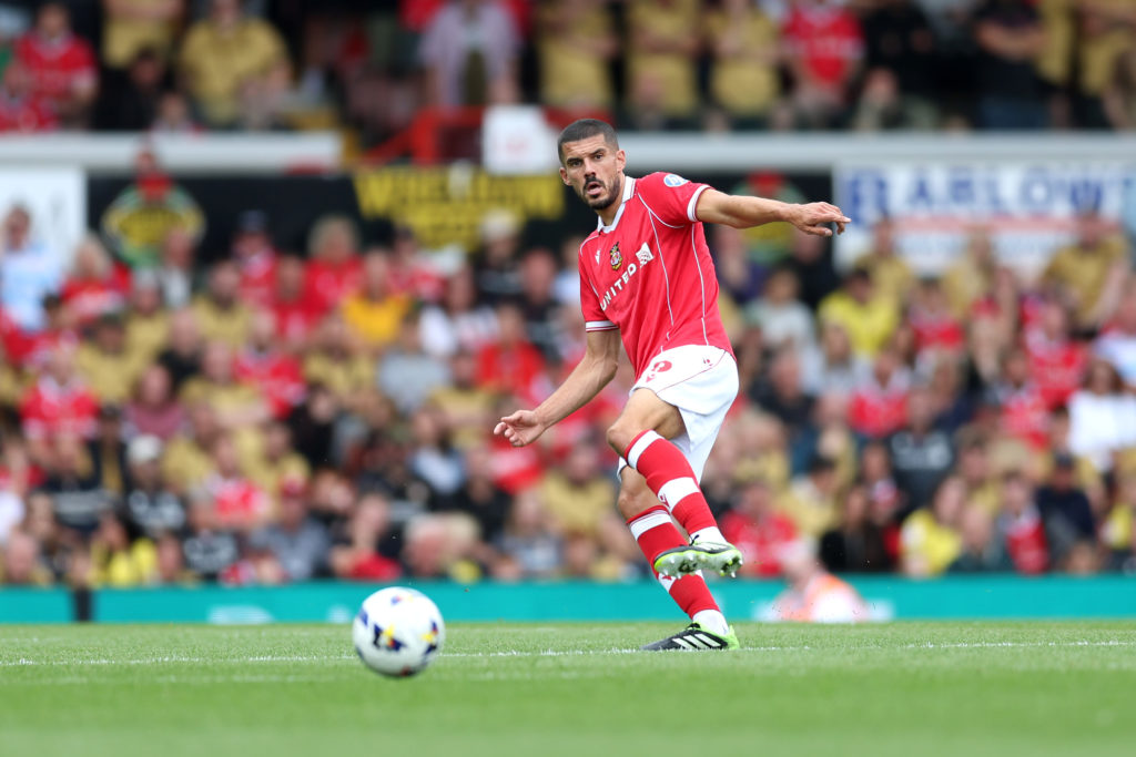 Conor Coady of Wrexham passes the ball