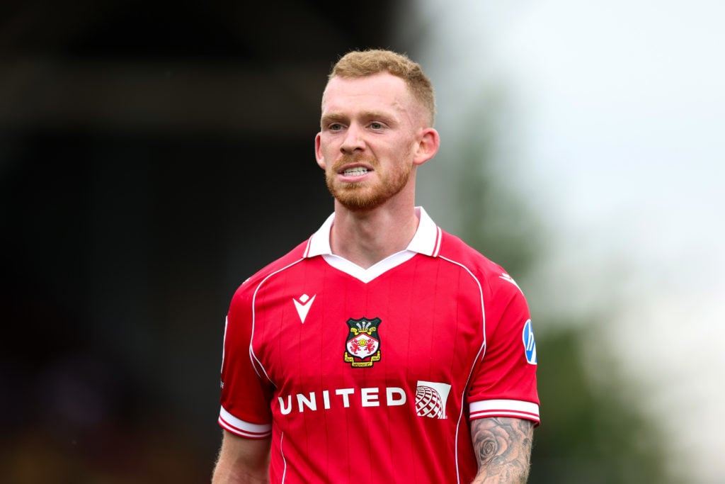 Lewis O'Brien of Wrexham looks on