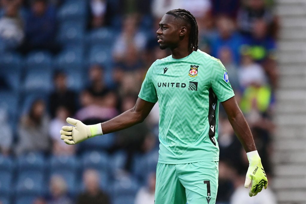 Wrexham's Arthur Okonkwo in action