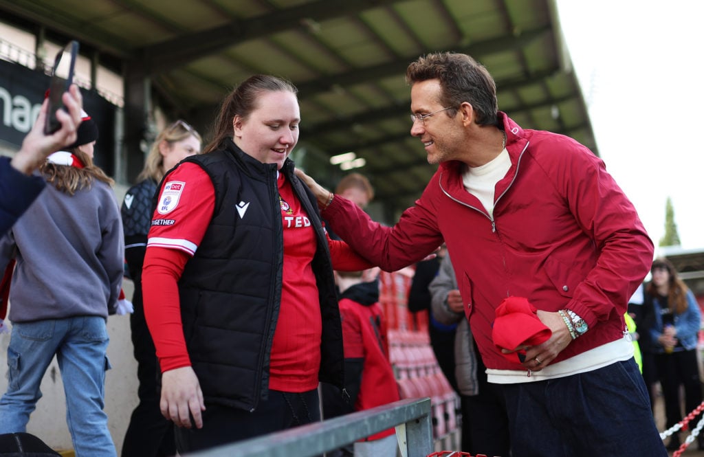 Ryan Reynolds with a Wrexham fan ahead of QPR match