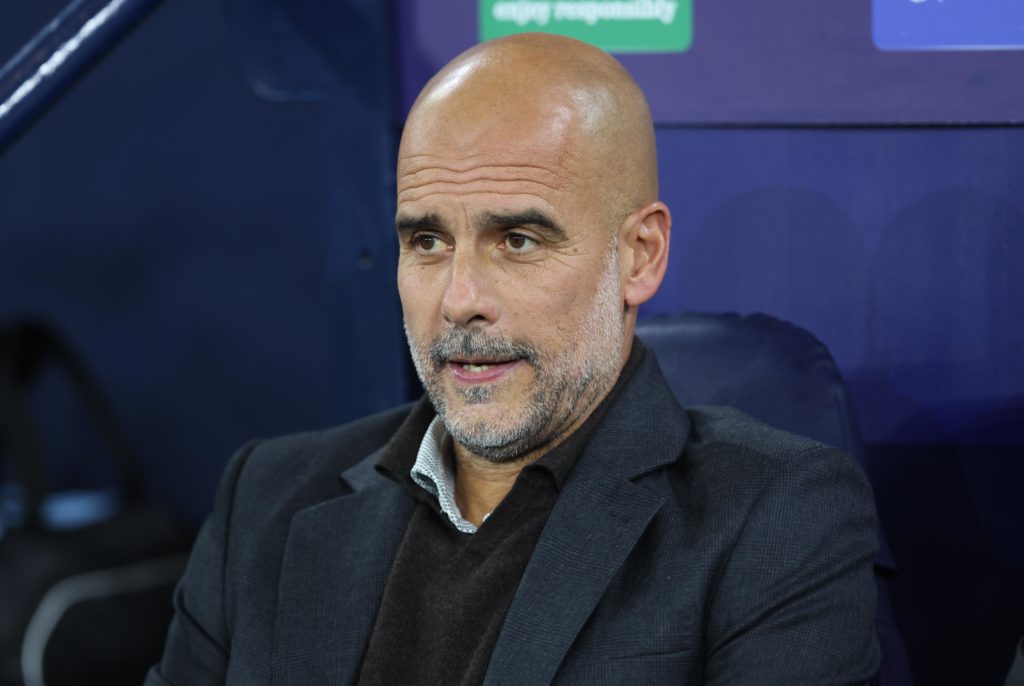 Manchester City boss Pep Guardiola looks on v SSC Napoli