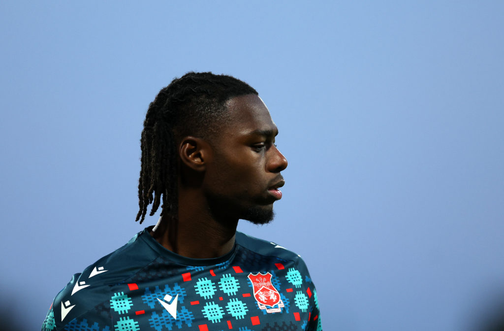 Arthur Okonkwo warms up before Wrexham v Reading