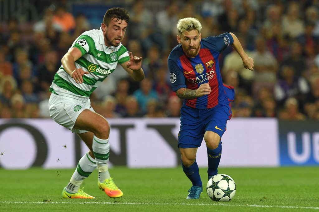Barcelona's Argentinian forward Lionel Messi (R) vies with Celtic's Irish defender Eoghan O'Connell