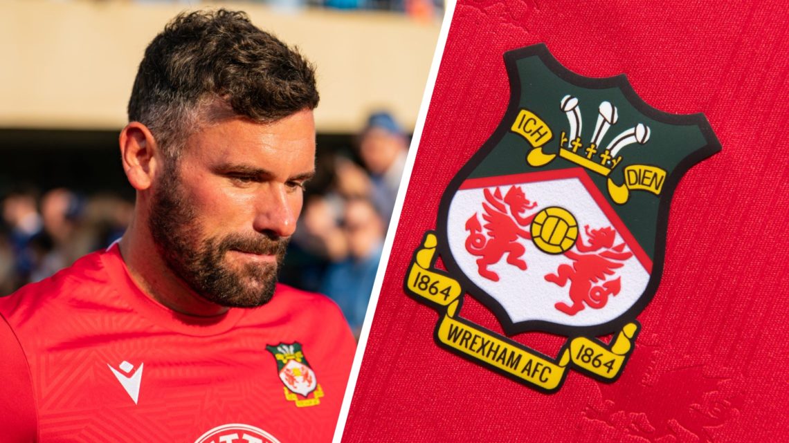 Ben Foster of Wrexham AFC warms up before a pre-season friendly match against Chelsea FC. Wrexham badge on a red home shirt.