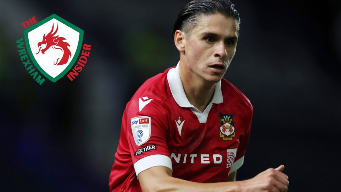 Wrexham player George Dobson in action.