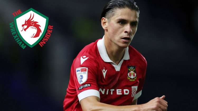 Wrexham player George Dobson in action.