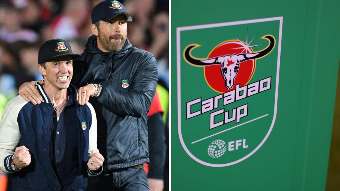 Rob McElhenney and Ryan Reynolds celebrate on the pitch after the English National League football match between Wrexham and Boreham Wood. A detail...