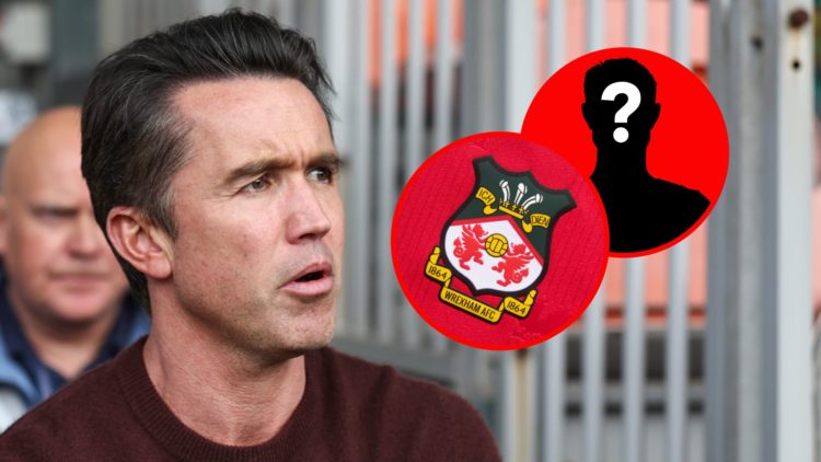 Rob McElhenney watches Blackpool vs Wrexham AFC - Sky Bet League One. Wrexham badge on a red home shirt.