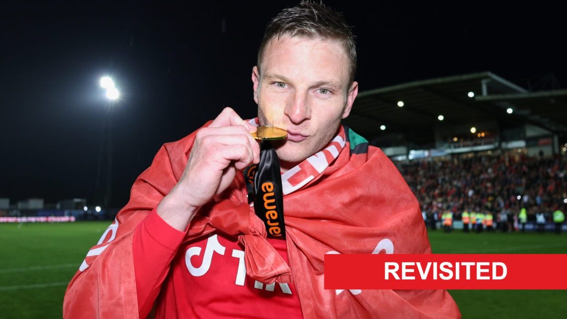 Paul Mullin of Wrexham kisses his National League winners medal