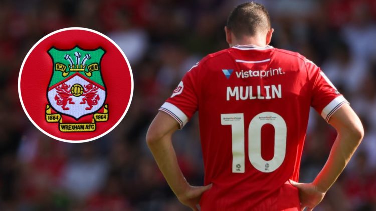 Paul Mullin during Wrexham v Doncaster Rovers - Sky Bet League Two. Detailed view of a Wrexham club crest.