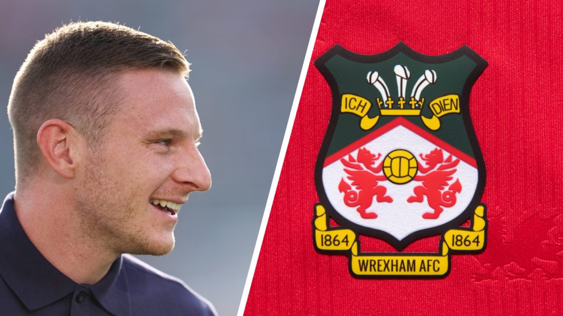 Paul Mullin prior to Chelsea FC v Wrexham - Pre-Season Friendly. The official club badge of Wrexham AFC on a home shirt.
