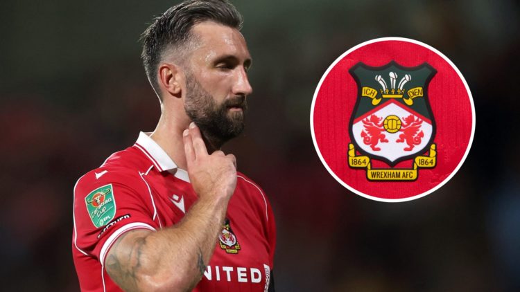Ollie Palmer celebrates for Wrexham against Hull City. The official club badge of Wrexham AFC on a home shirt.