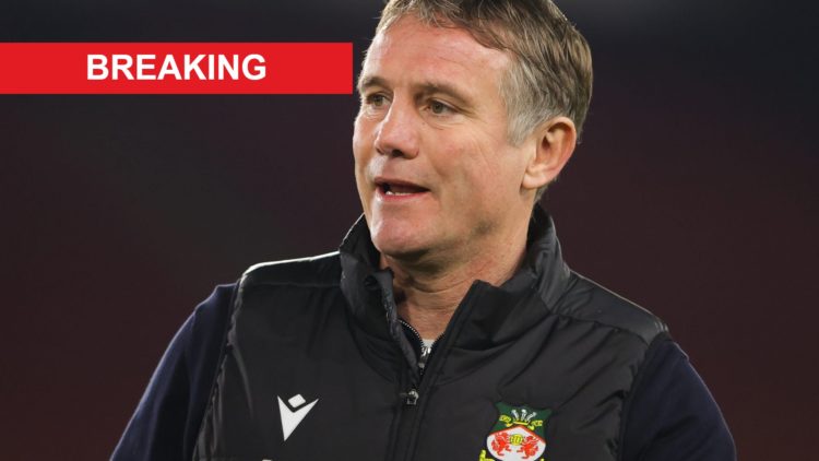 Phil Parkinson, manager of Wrexham, looks on