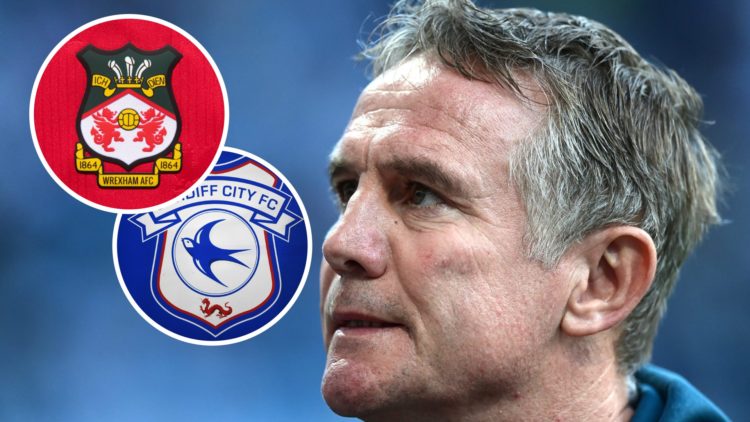 Wrexham boss Phil Parkinson looks on against Preston North End. Detailed view of a Cardiff City badge. The official club badge of Wrexham AFC on a ...
