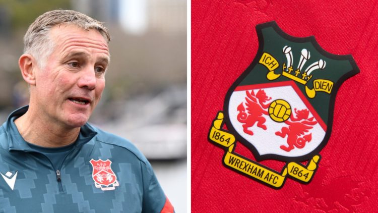 Phil Parkinson the coach of Wrexham speaks to the media. Wrexham badge on a red home shirt.