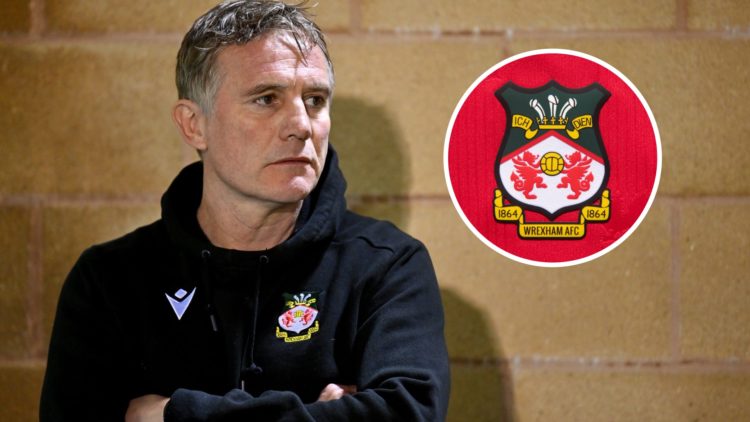 Wrexham boss Phil Parkinson watches on against Forest Green Rovers. The official club badge of Wrexham AFC on a home shirt.