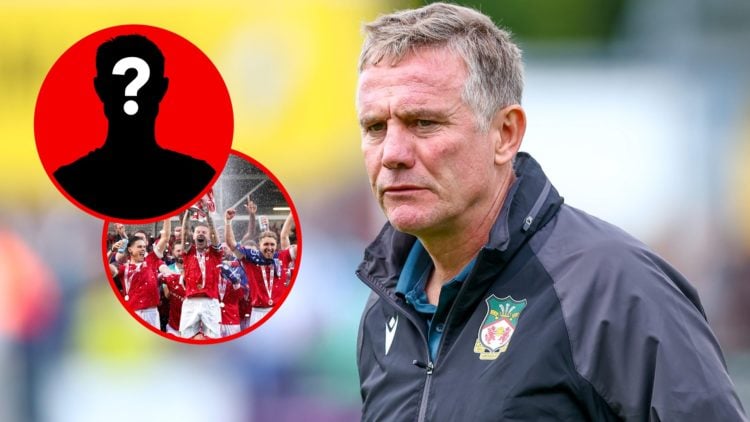 Phil Parkinson of Wrexham AFC looks on. Wrexham players celebrate winning promotion to the Championship after beating Charlton Athletic.