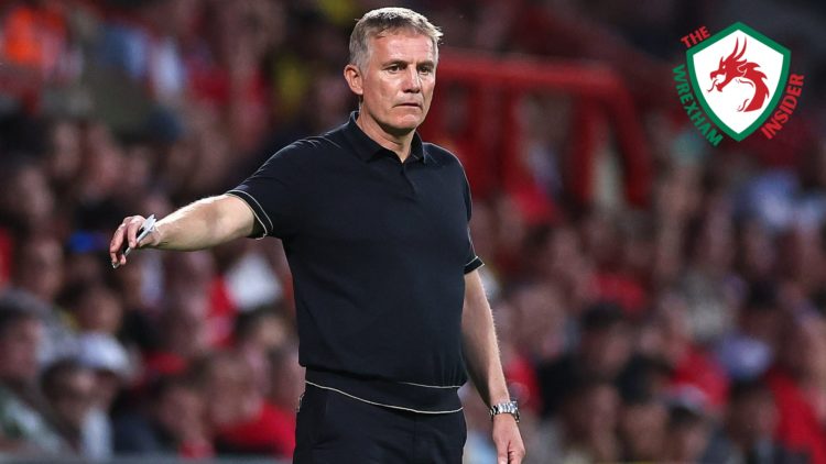 Wrexham manager Phil Parkinson stands on the touchline.
