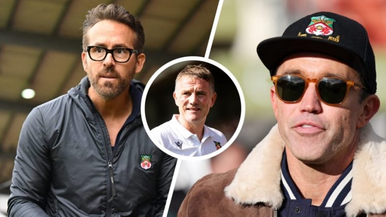 Ryan Reynolds walks pitch-side ahead of the English National League football match between Wrexham and Boreham Wood. Rob McElhenney wearing a Wrexh...