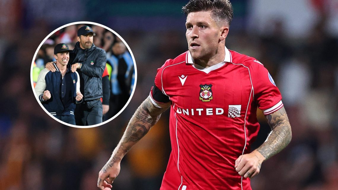 Josh Windass of Wrexham during the Carabao Cup first round match between Wrexham and Hull City. Ryan Reynolds and Rob McElhenney celebrate promotio...