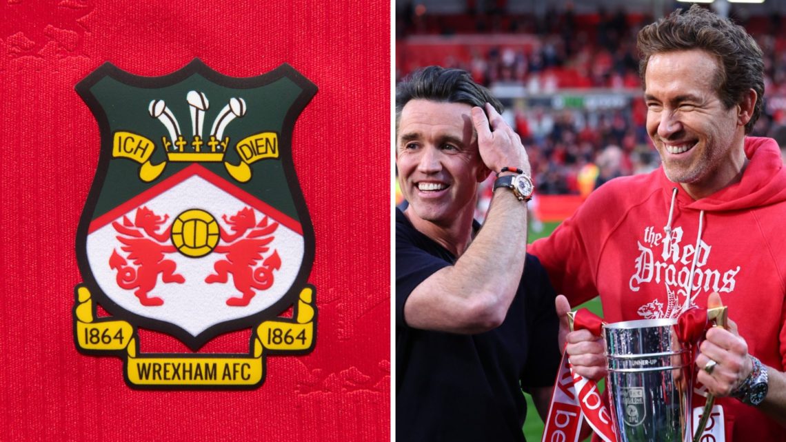 The official club badge of Wrexham AFC on a home shirt. Rob McElhenney and Ryan Reynolds co-owners of Wrexham with the promotion trophy during the ...
