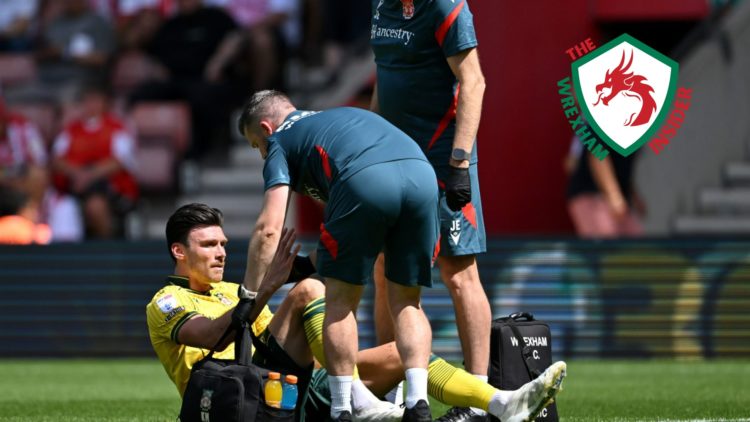 Wrexham striker Kieffer Moore is down injured.