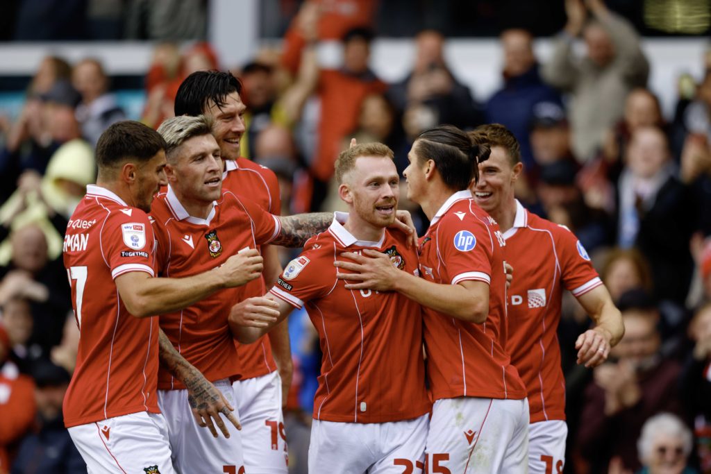 Wrexham players celebrate Lewis O'Brien goal against Derby County