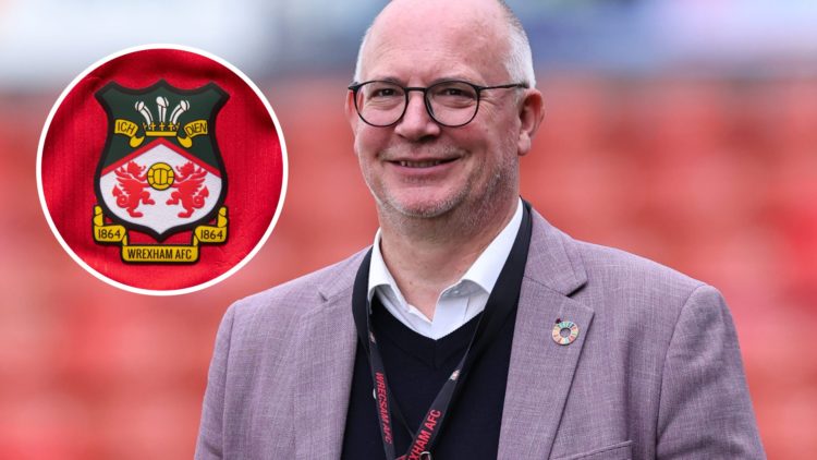 Shaun Harvey smiles before Wrexham AFC v Charlton Athletic FC in the Sky Bet League One clash. The official club badge of Wrexham AFC on a home shirt.