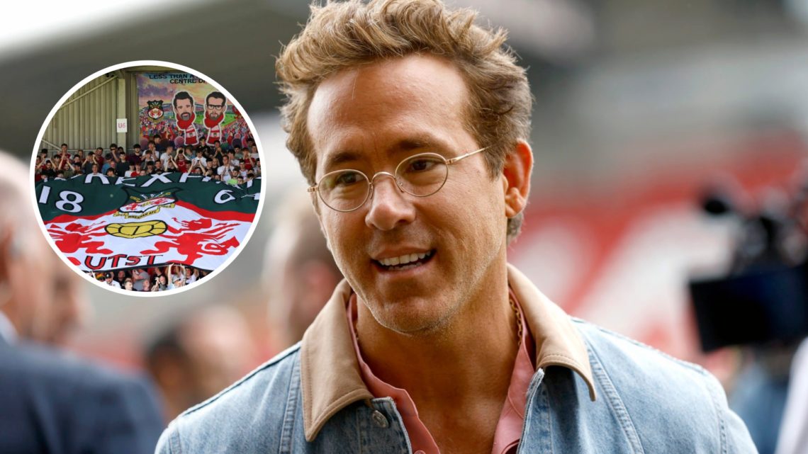 Ryan Reynolds before Wrexham AFC v West Bromwich Albion - Sky Bet Championship. Fans of Wrexham display a flag of their badge with a banner of owne...
