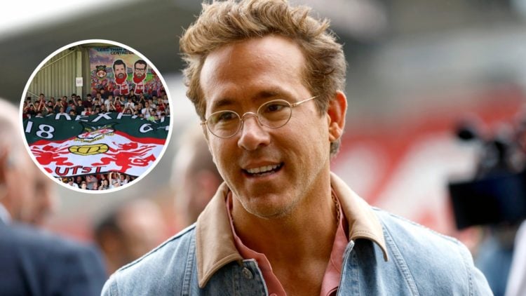 Ryan Reynolds before Wrexham AFC v West Bromwich Albion - Sky Bet Championship. Fans of Wrexham display a flag of their badge with a banner of owne...