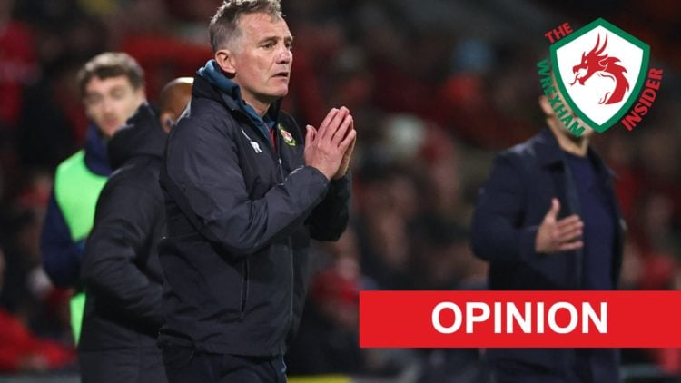 Wrexham manager Phil Parkinson stands on the touchline.